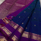 Purple Allure – Pure Kanchipuram Silk Saree
Peacock-blue body adorned with petite zari floral buttas 🌸
Contrast royal-purple border with grand elephant procession 🐘
Rich zari brocade pallu in floral motifs ✨

Silk Mark Certified, delivery in 2 weeks