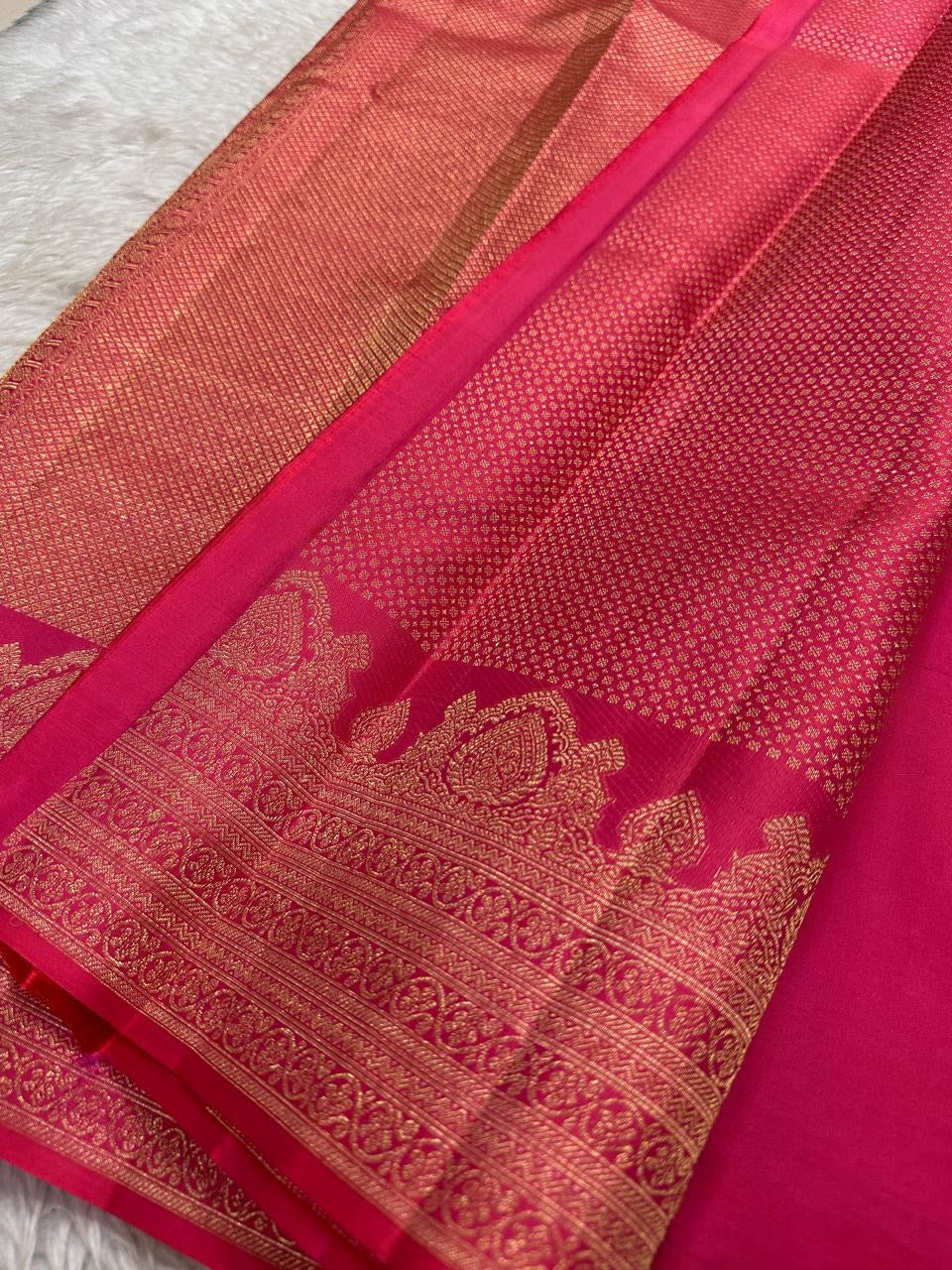 Kemp Kanchi Collection – Rosy Coral Pink
Pure Kanchipuram Silk with Gold Leaf Buttas & Temple Zari Borders
Silk Mark Certified • Free Shipping within USA • Ships in Two Weeks