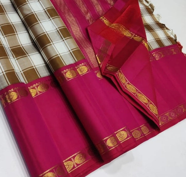 Ivory & Caramel beige Checked Pure Silk Saree

Rani-Pink Rettapet Border with Gold Zari Coin Roundels

Rich Rani-Pink Zari Pallu with Chevron & Stripe Weave

Pink Blouse Piece with Matching Zari Border
silk Mark certified , 2g Zari korvai Kanchipuram