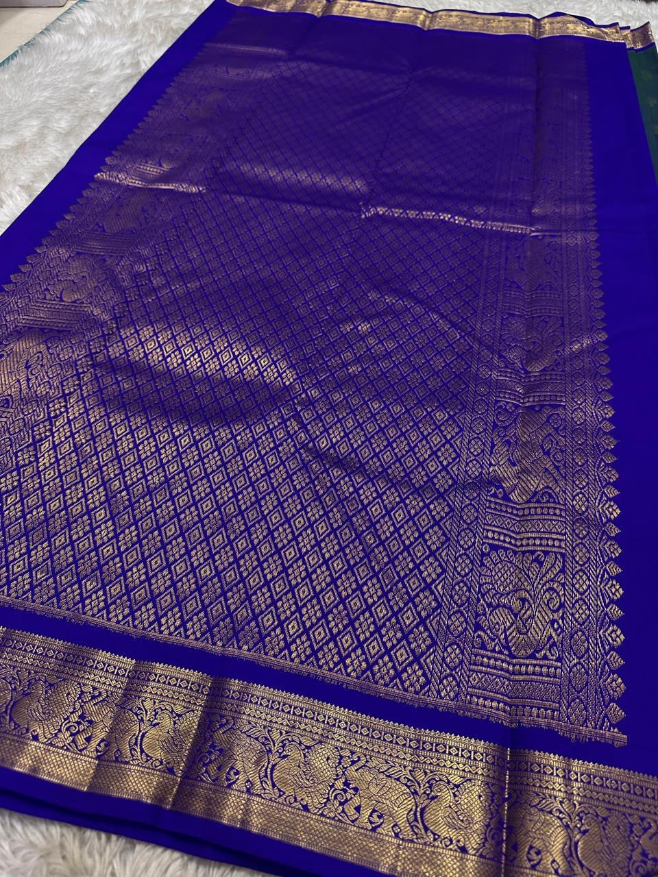 Neelam Light Weight – Budget Kanchipuram Silk Saree
Peacock-blue body with gold zari gaja & medallion buttas
Royal blue border with peacock & floral zari detailing
Ships in two weeks
Silk Mark Certified | Fall & Pico Done