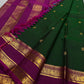Full saree view with emerald green body, magenta pallu and gold zari borders with tassels