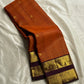 Rust Orange Kattam Rettapet – Pure Silk Kanchipuram Saree
Rust Orange Body with Petite Gold Buttas & Fine Kattam Grid
Deep Aubergine Rettapet Korvai Double-Line Contrast Border
Rich Zari Diamond & Chevron Brocade Pallu
Comes with Contrast Aubergine Blouse