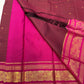 Arakku Kattam Mayura Chakram – Pure Silk Kanchipuram Saree (Maroon & Rani Pink)

Micro-check body with tiny gold buttas; vibrant rani contrast

Antique-gold peacock chakram border & grand woven zari pallu

Silk Mark Certified | Blouse Piece Included |