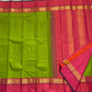 Valli Pachai – Kanchipuram Pure Silk Saree

Parrot-green body in kattam (grid) checks with subtle zari lines

Korvai contrast rani-pink borders featuring gaja (elephant) procession & temple reku motifs

Rich rani-pink zari pallu with vertical bands