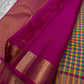 A classic Kanchipuram in Pattani Kattam checks with green, magenta, mustard, and cream.
Finished with a contrast pink border and pallu.
Paisley and chakram motifs in a graceful grid add timeless charm.