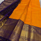 This Maambazha yellow Kanchipuram silk saree features zari mayil buttas and a deep blue rettapet border with kamalam motifs — a timeless blend of tradition and grace.