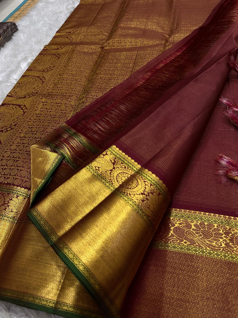 Burgundy Vairaoosi – Pure Kanchipuram Silk Saree
Classic burgundy body woven with Vairaoosi ✨
with delicate gold floral medallion buttas for temple elegance
antique-gold korvai borders with rosettes & chevron. Silk Mark Certified, delivery in 2 weeks