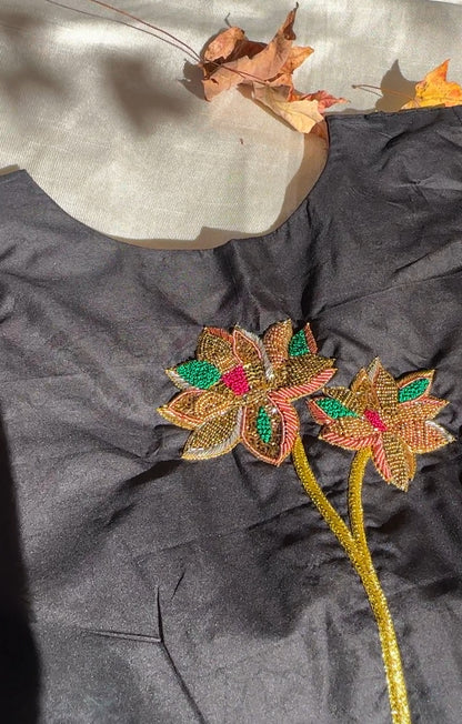 Black Silk Cotton Blouse. Hand-embroidered floral pattern in pink, green, copper, and gold