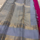 Fuchsia in Sky – Pure Silk Kanchipuram Saree
Sky Blue Body with Gold Kattam Checks & Petite Buttas
Fuchsia Contrast Petni Pallu with Zari Reku Stripes
Wide Gold Zari Border with Peacock & Temple Motifs
Silk mark certified, ships in 2 weeks
