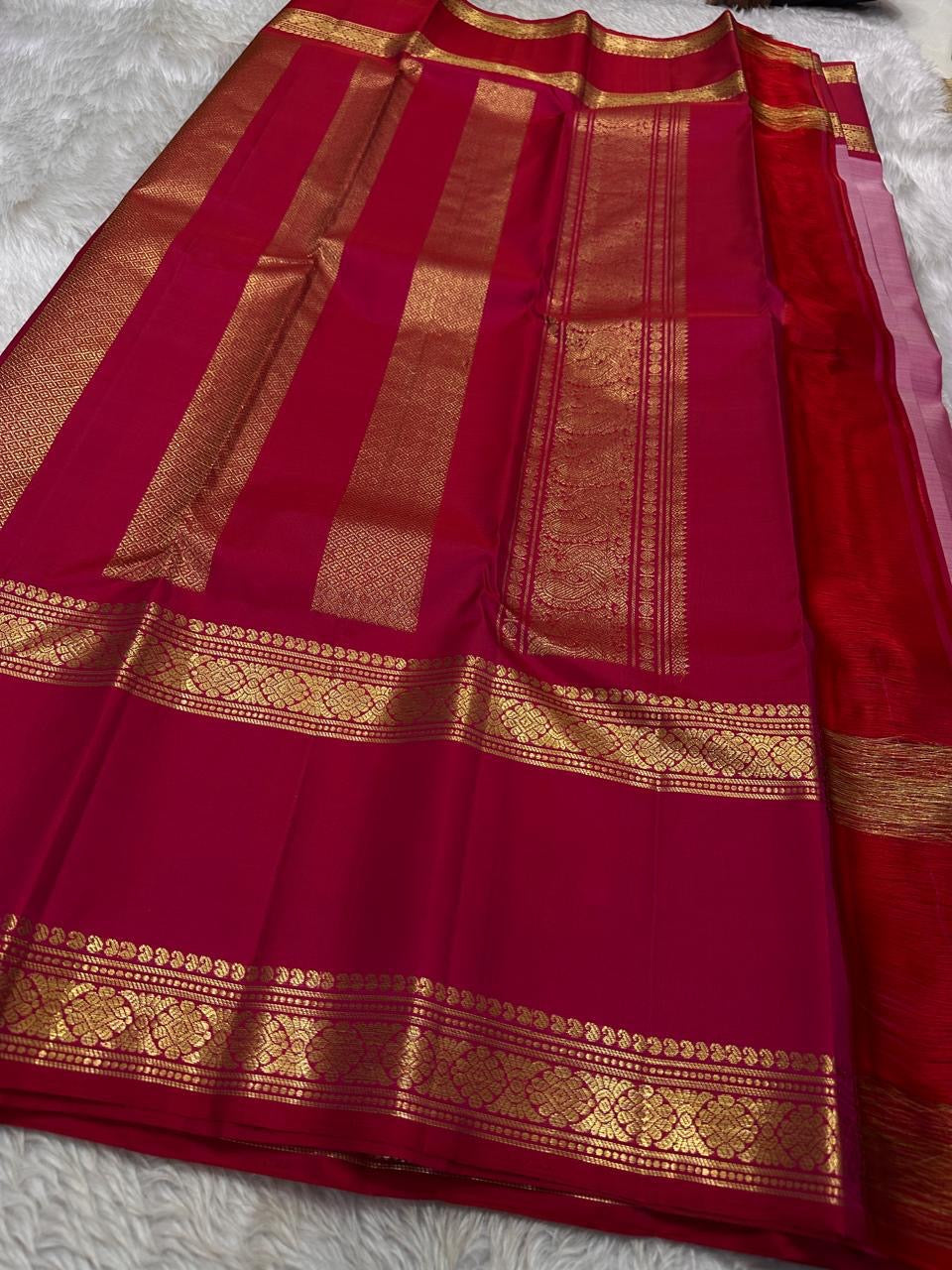 Pure silk kanchipuram rose pink color body with zari mayil chakram  buttas , raspberry pink  border with ornate Pallu