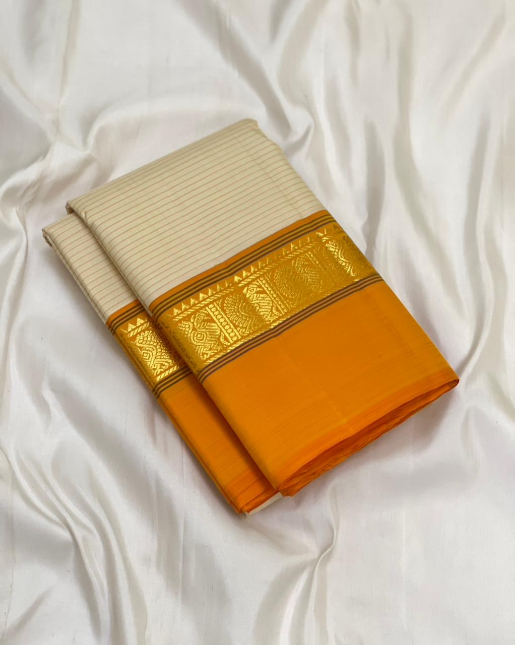 Sweta Kanakam Kattam — Pure Kanchipuram Silk Saree
Ivory Pinstripes × Marigold border with Antique-Gold Zari Border
Silk Mark Certified • Free Shipping within USA • Ships in Two Weeks