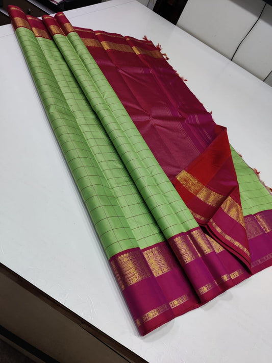 Pistachio Spring ✨ – Pure Kanchipuram Silk Saree
Pistachio Green Body with Elegant Kattam Checks
Red-Pink Shot Korvai Border with Gold Zari Motifs
Ruby-Red Pallu with Broad Zari Panel

Silk Mark Certified, delivery in 2 weeks