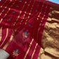 Close view of Raspberry Red Chanderi silk saree with turquoise-and-gold floral woven buttas