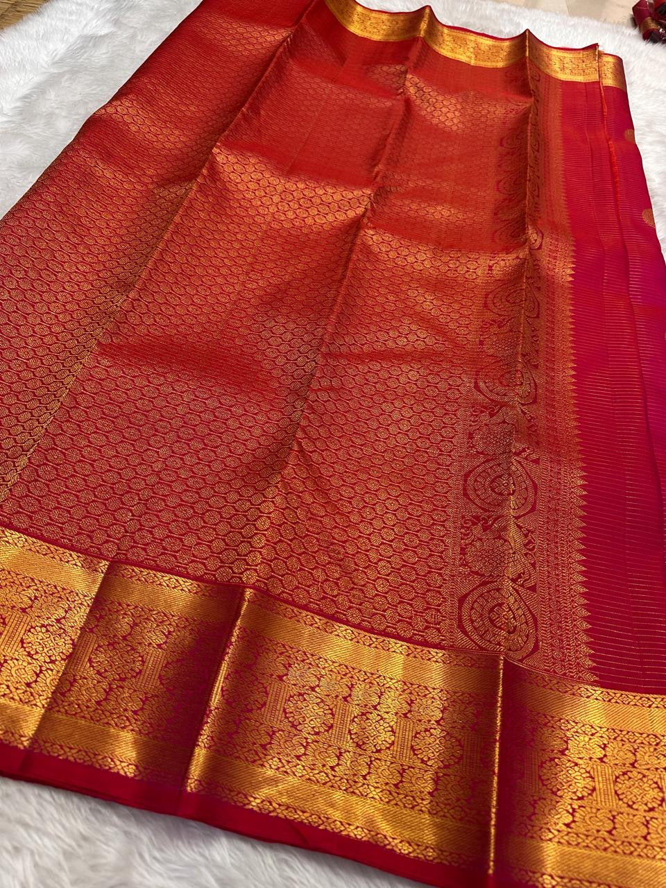 Pure Kanchipuram silk saree in radiant pink featuring classic vairaoosi zari lines