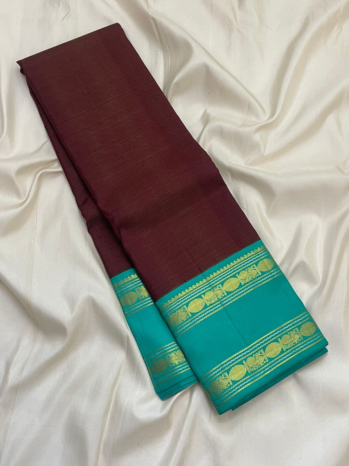 Close view of vairaoosi zari lines on deep brown Kanchipuram silk saree