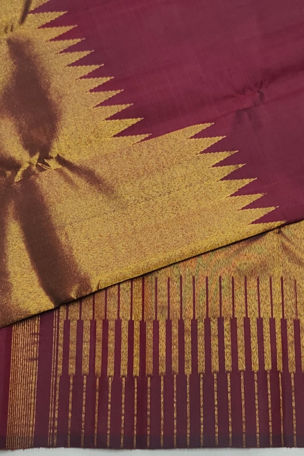 Antique gold Kanchipuram silk saree with maroon contrast pallu and traditional gold zari
