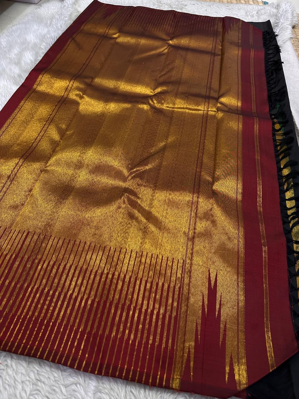 Golden zari-rich Ettukol pallu of Kanchipuram silk saree with temple peak pattern