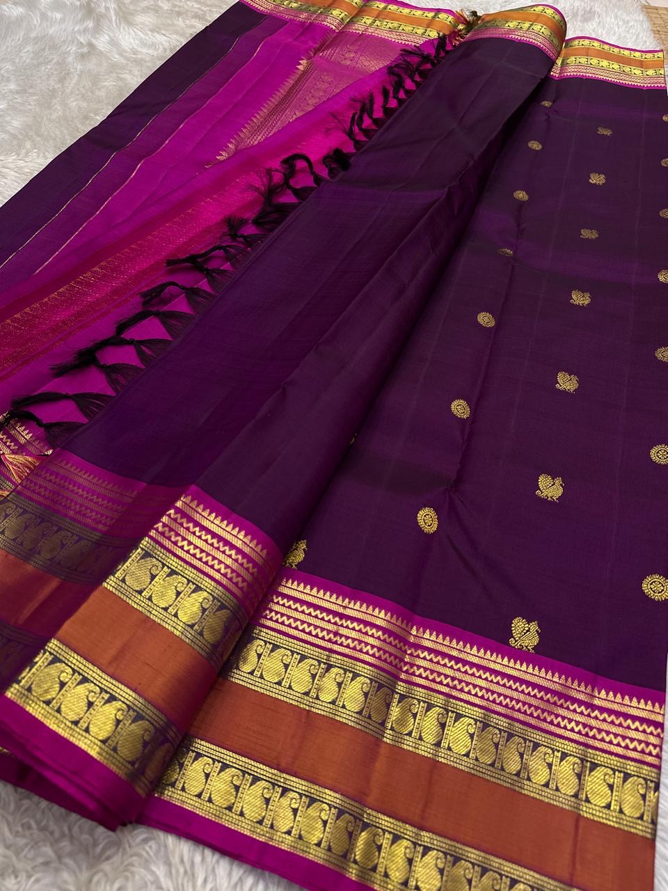 Kavyashree Plum Lustre — Pure Kanchipuram Silk Saree
Deep Plum Body with Gold Buttas, Rust–Magenta Korvai Borders
Silk Mark Certified | Free Shipping within USA | Ships in Two Weeks