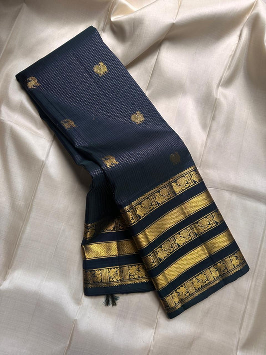 Varisaipet silk black Kanchipuram layers of gold zari work border with halo Mayil Butta body - ornate Pallu