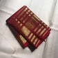 Deep plum Kanchipuram silk body with close-set antique gold oosivaanam lines and spaced gold buttas