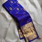 Kalyana Neelam Kattam — Kanchipuram Pure Silk

Deep royal neelam blue body with kattam (grid) checks & mayil buttas

Grand gold kaddi border with ornate paisley vines; rich zari pallu

Silk Mark Certified | Free Shipping within USA

Dispatch in 1 Week