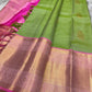 Spring green silk saree with pink zari woven border, gold buttas and contrast pallu, full view