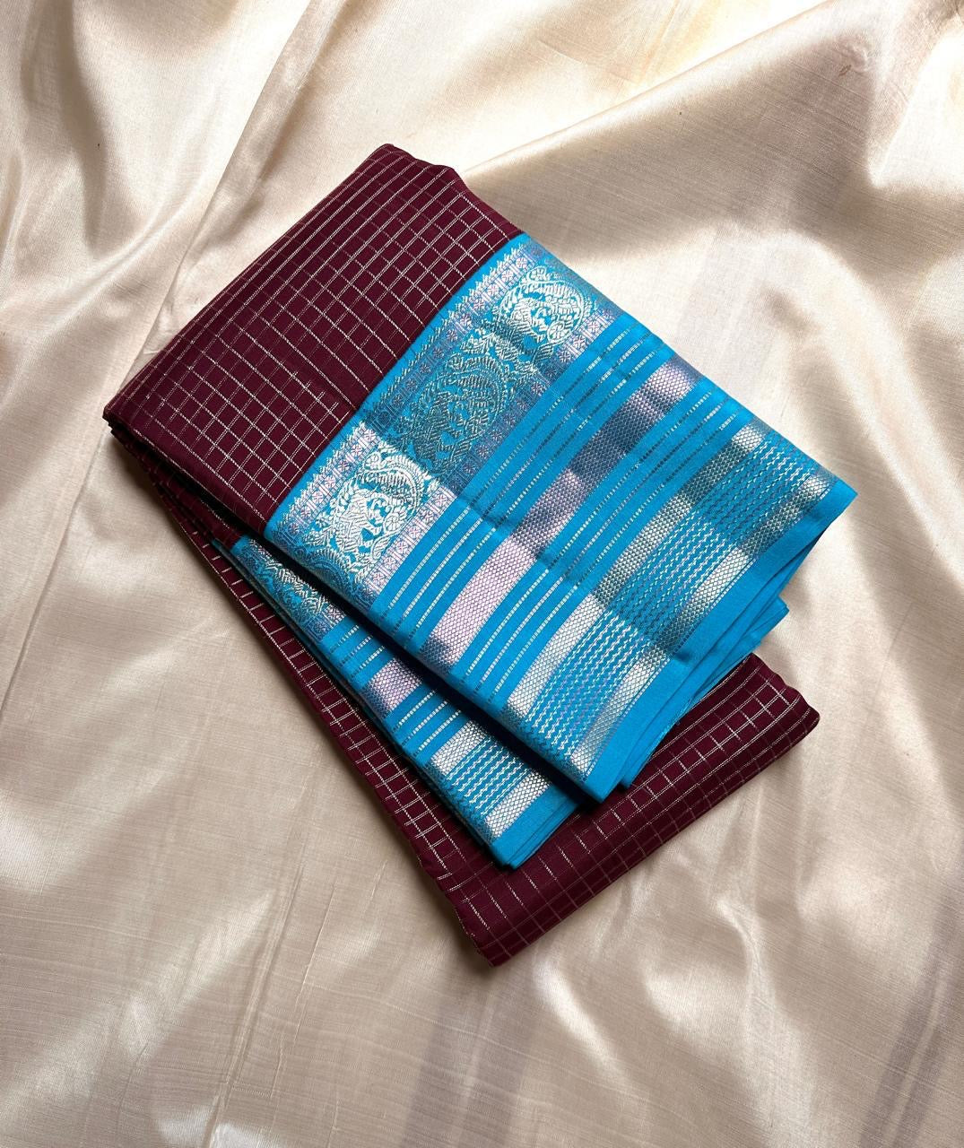 Most unique brown and blue combination in pure silk Kanchipuram with Zari kattam and elephant motif border