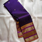 Swarna Laya — Pure Silk Kanchipuram Saree
Deep vaadamalli purple with gold zari buttas, antique-gold border, and rich striped pallu.
Silk Mark Certified • Free USA Shipping • Ships in Two Weeks.