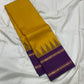 Suvarna Nitya
Mustard–Purple Kanchipuram Silk Saree
Heritage Temple Reku • Gold Zari Borders • Silk Mark Certified