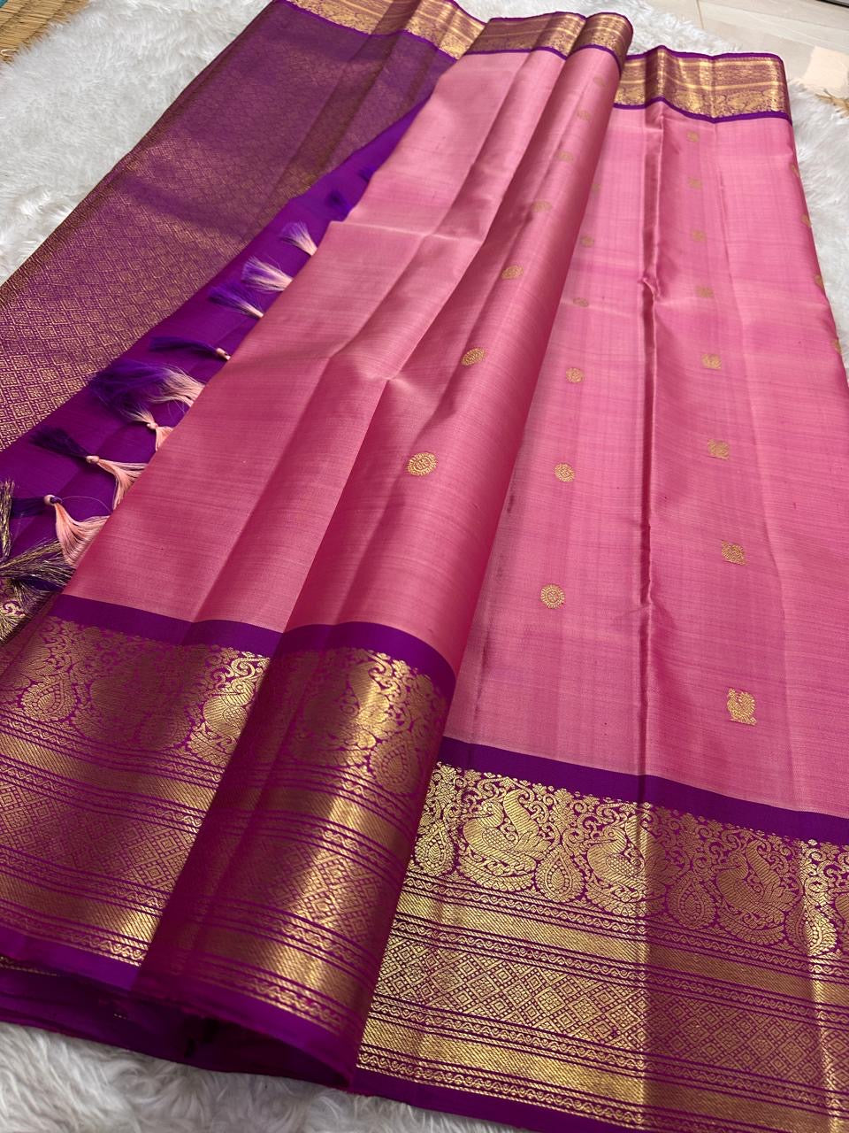 A dazzling blend of pink and purple silk, enriched with golden zari for a look that’s both festive and feminine.