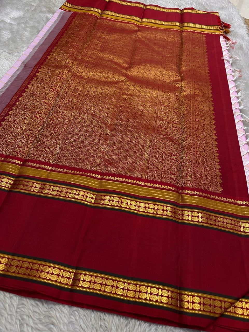 Pastel Pink Zari Kattam
Blush-pink  Kanchipuram Silk Saree
Contrast Maroon Borders in Gold Zari