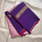 Anaar ✨ – Royal Purple & Lotus Pink Kanchipuram Pure Silk Saree
With Zari Kattam Checks, Mayil Motif Border & Grand Pallu
Korvai Contrast Weave in Regal Purple , 
Peacock & Floral Zari Panels, Raspberry Selvedge Finish
Silk Mark Certified