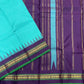 Gopura Neelam — Kanchipuram Pure Silk Saree

 

 

Teal-green body with micro kattam checks for a sleek drape

Regal aubergine korvai border with gopuram/temple motifs & gold zari

Parrot-green selvedge for a fresh, festive pop of contrast

Aubergine pall