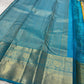 This radiant yellow pure silk drape is elevated by an exquisite and unexpected pairing — a serene sky blue border, making it both eye-catching and rare. Fine zari checks shimmer gently across the body, timeless bavaanji border