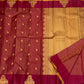 Full view of maroon vairaoosi zari kattam saree with scattered gold elephant buttas, wine border, and gold zari pallu.