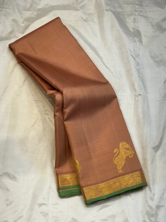 Tamra Yazhi — Pure Kanchipuram Silk vairaoosi with Antique Gold zari  Yazhi Motifs
green-edged traditional brocade border
Silk Mark Certified • Free Shipping within USA • Ships in Two Weeks
