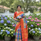 Ratna Mala ✨ – Pure Kanchipuram Silk Saree
Multicolor Checked Body in Vibrant Jewel Tones
Deep Red Korvai Border with Gold Zari Weaving
Grand Red Zari Brocade Pallu with Traditional Motifs
A Regal Handwoven Drape – Perfect for Weddings & Festive Wear!
