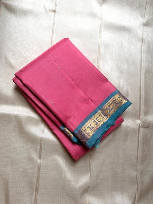 Varnam – Pastel Pink Kanchipuram Silk Saree with Sky Blue Rudraksha Border & Grid Zari Pallu | Baby Kamalam Buttas | Pure Handloom Elegance