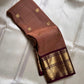 Biscuit Brown Glow – Korvai Kanchipuram Pure Silk Saree
Biscuit-brown (rust shot) body with gold chakram & paisley buttas
Rich deep-brown korvai border with annam medallions & diamond mesh
Grand deep-brown zari pallu |… read description