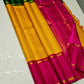 Suvarna Kattam ✨ – Pure Kanchipuram Silk Saree
Golden Mustard Body with Intricate Kattam Checks
Vibrant Magenta Pink Border with Zari Detailing
Emerald Green Selvedge Adding Striking Contrast

Silk Mark Certified, delivery in 2 weeks