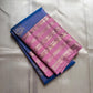 Ramyam, meaning pleasant and delightful, features a mesmerizing blue–purple shot body that shimmers with every movement. Its radiant pink korvai border and pallu, adorned with traditional Varisaipet zari stripes, add festive brilliance.silk mark certified