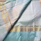 Body: pastel lemon-cream with tiny gold zari buttas

Borders/Pallu: sea-foam aqua with temple (reku) peaks & paisley vine zari

Silk Mark Certified • Free USA Shipping • Ships in Two Weeks