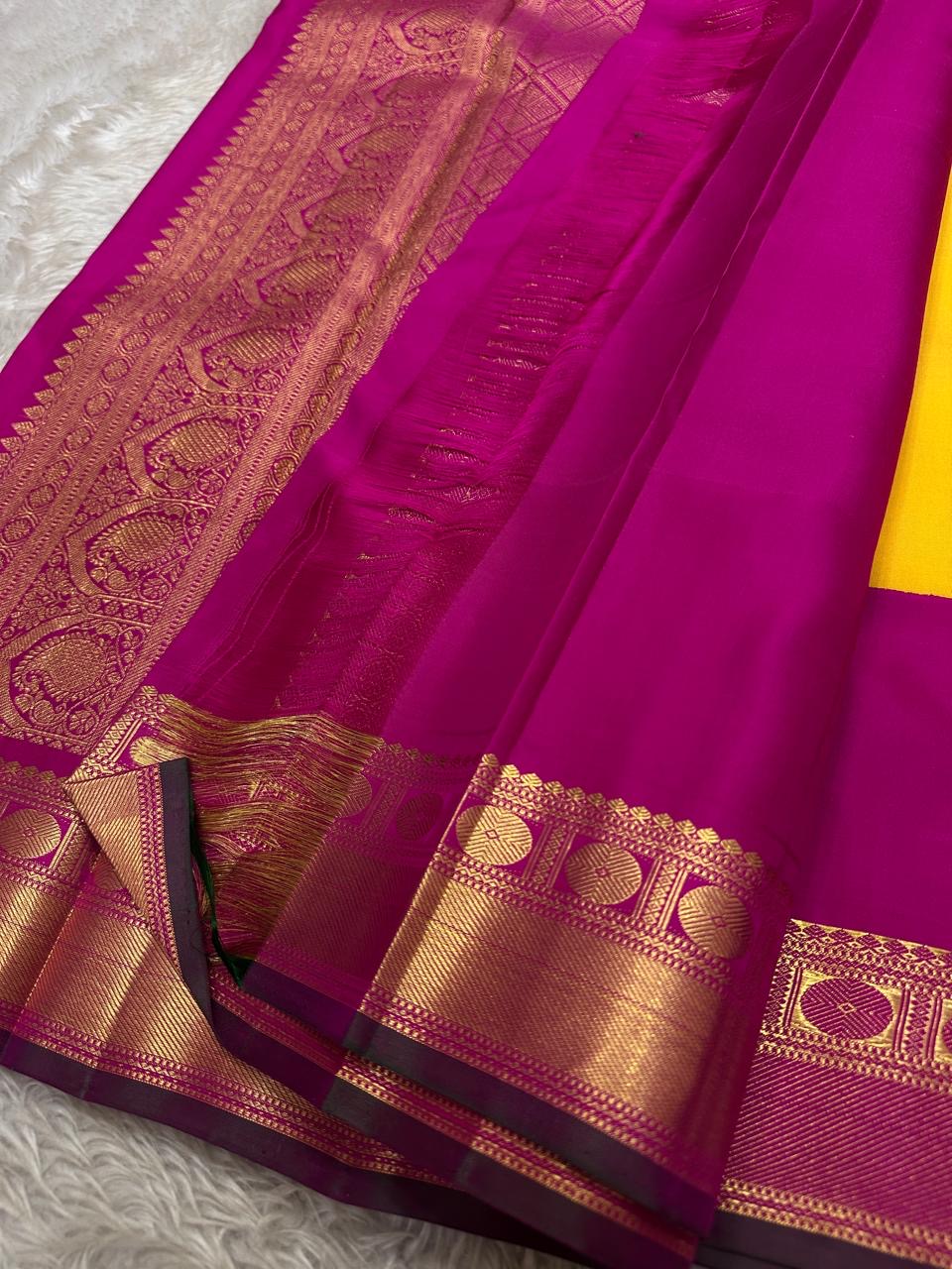 Manjula – Vibrant Yellow Pure Silk Kanchipuram Saree with Handwoven Magenta Benares-Style Dual Border, Maanthulir Green Selvedge, and Intricate Paisley, Rudhraksham & Floral Motifs on Pallu