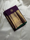 A majestic union of deep purple silk and emerald grace! Mayil chakram butta peacock border