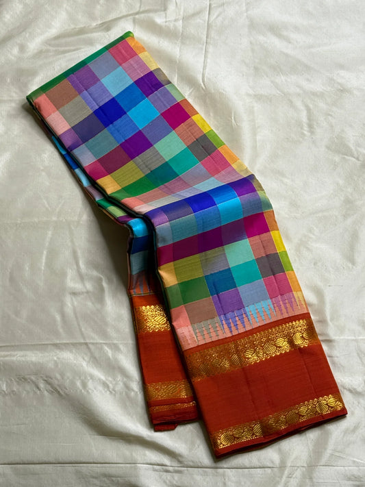 Multicolor checked pure Kanchipuram silk saree with deep red korvai border and gold zari detailing