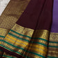 Kaamini ✨ — Purple Pure Kanchipuram Silk Saree
With Elegant Brown Korvai Border & Bold Stripes
Adorned with Scattered Gold Zari Buttas on Body
Intricate Zari Weaving in Regal Brown Pallu
Contrast Blouse with Matching Korvai Border