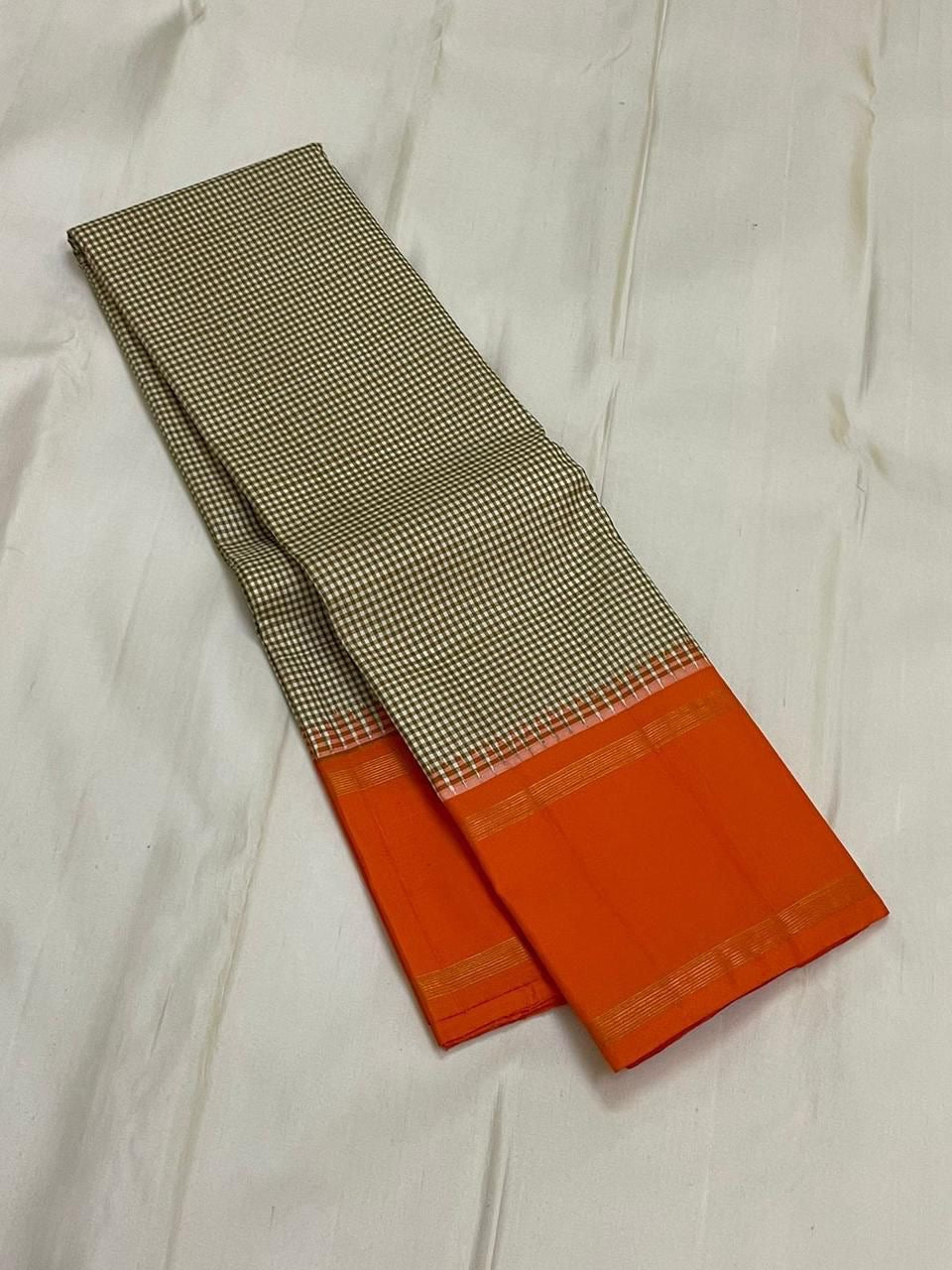 Rust Kattam Korvai – Pure Silk Kanchipuram Saree
Olive–Ivory Micro-Checks Body with Korvai Join
Rust Orange Border
Rust Orange Pallu pillayar Reku
Comes with Matching Rust Orange Blouse Piece with Zari Border silk mark certified - ships in 2 weeks