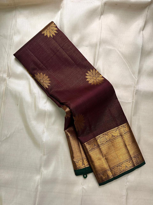 Bronze Lotus Vairaoosi
Coffee-Deep Kanchipuram Silk Saree
Grand Zari Borders • Lotus Butta Elegance