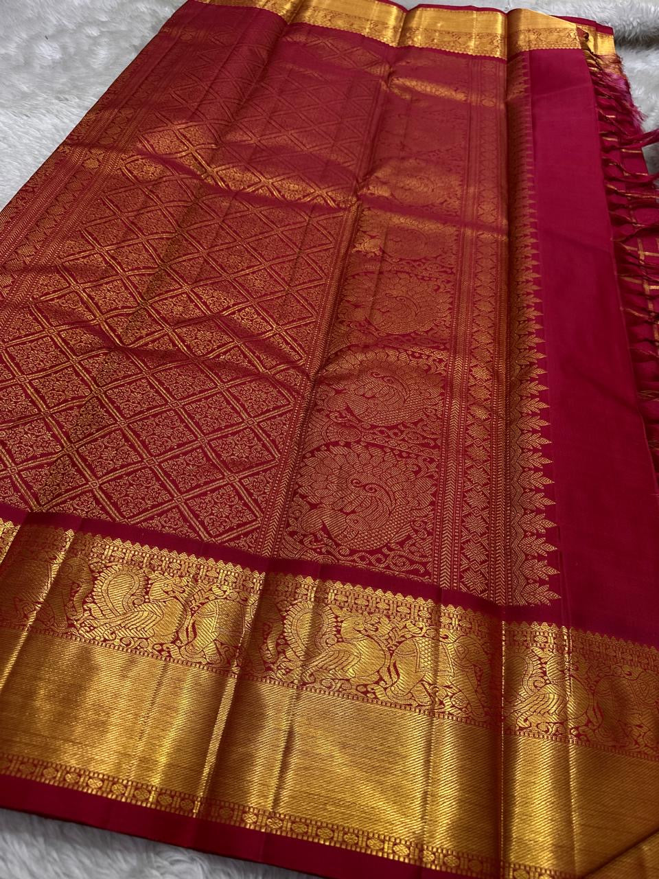Leelavati Kattam Red
Kumkum-Red Kanchipuram Silk Saree
Zari Kattam Checks & Elephant Procession Border