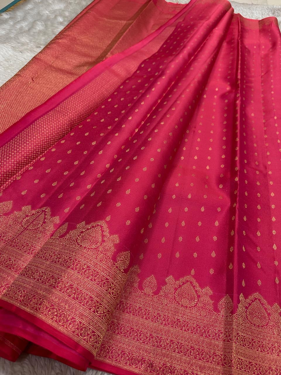 Kemp Kanchi Collection – Rosy Coral Pink
Pure Kanchipuram Silk with Gold Leaf Buttas & Temple Zari Borders
Silk Mark Certified • Free Shipping within USA • Ships in Two Weeks